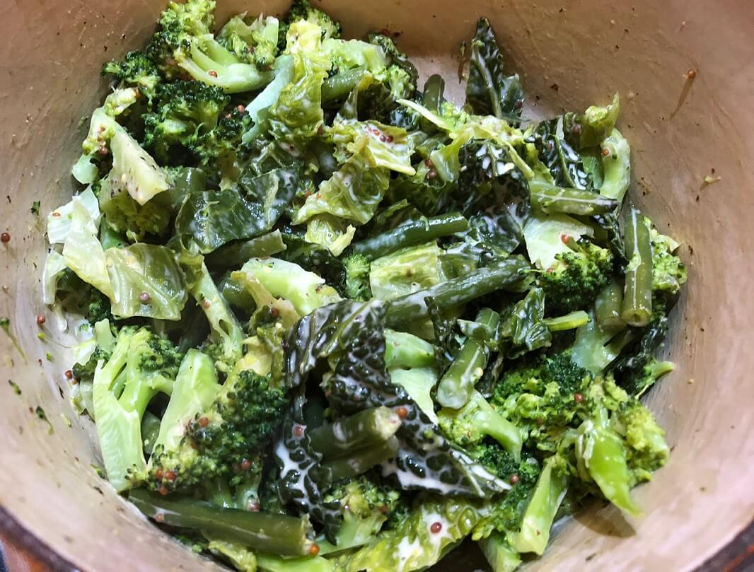 Broccoli, green savoy cabbage and green beans braised in a bit of vegetable stock and then treated to a coating of cream, wholegrain mustard and just a hint of garlic!